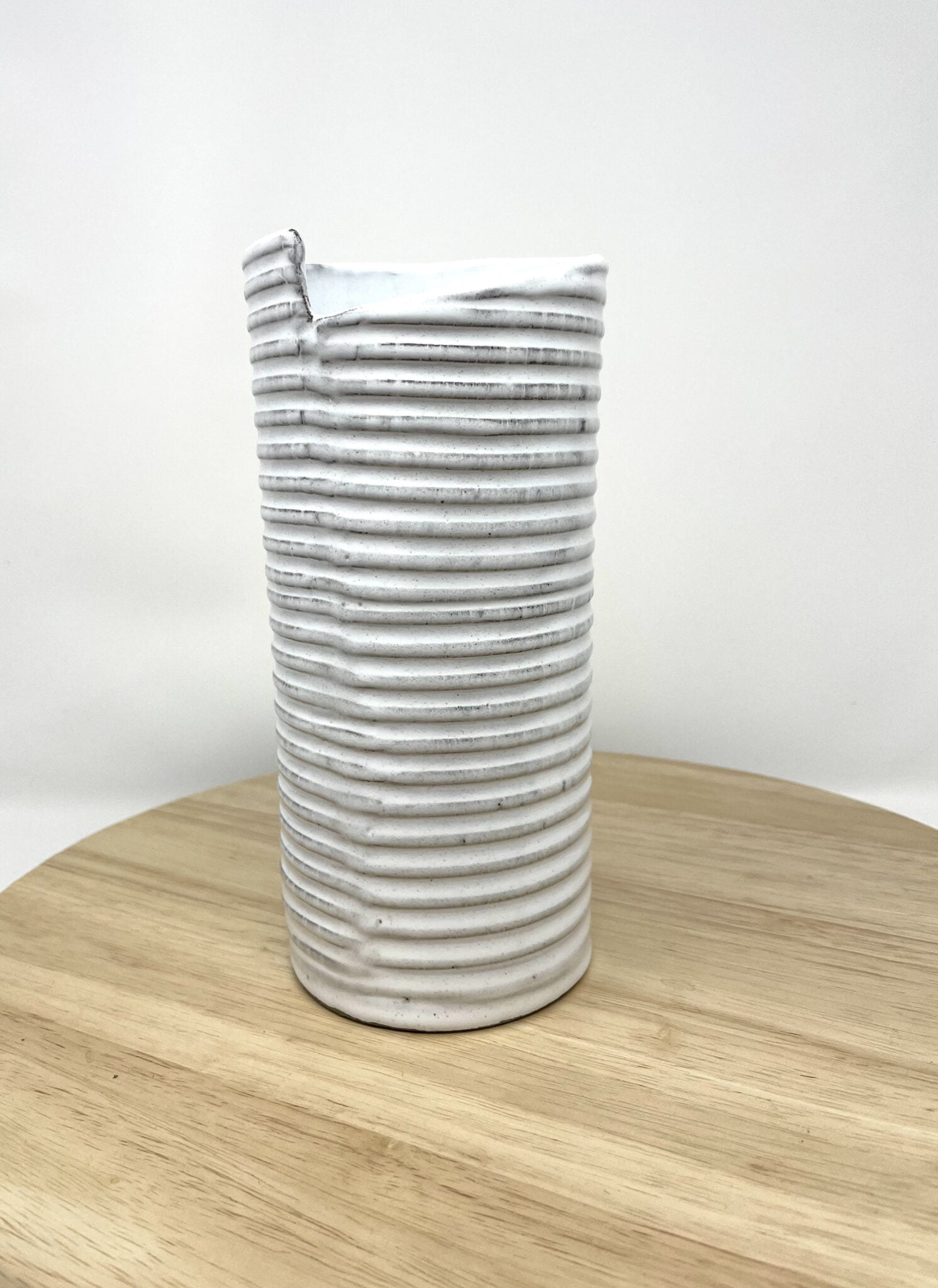 Hand-Built White Striped Ceramic Vase — scale view