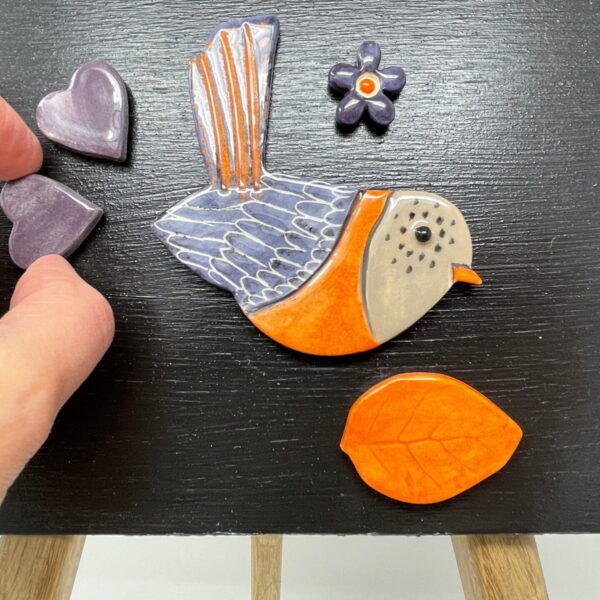 A Bird, love heart shaped magnets, a flower and a leaf ceramic fridge magnets 5 in a set in purple and orange colours/ magnetic canvas