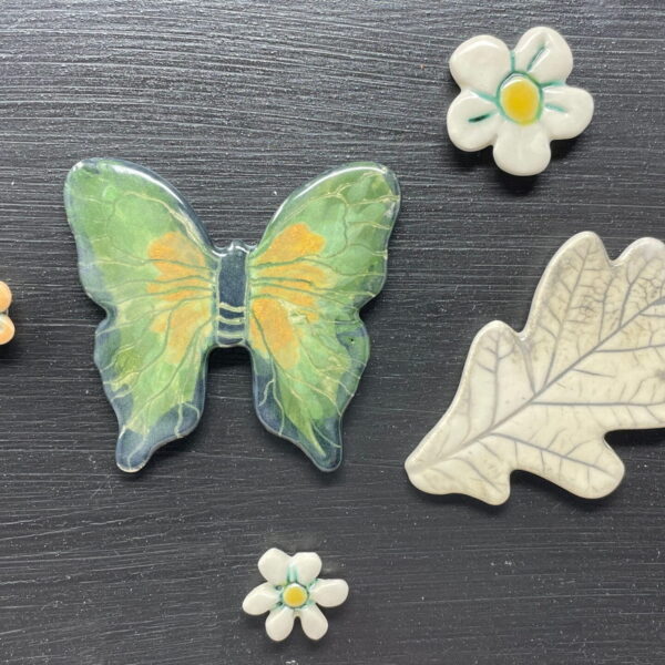 Green handmade ceramic butterfly magnet in a set with flowers and and oak leaf / Artisan Etsy Decor with magnetic black board