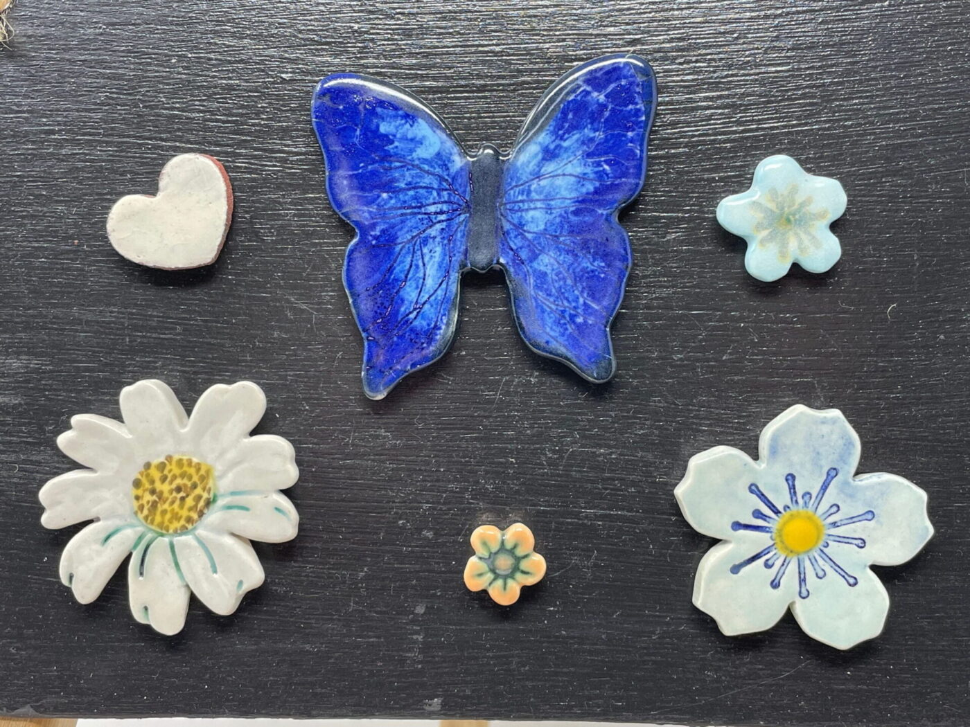 Cobalt Butterfly Magnet Set — Blue, Orange & White Flowers — in use