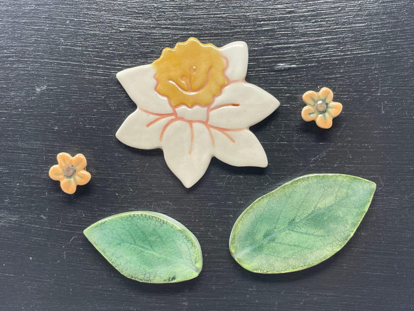 Ceramic Daffodil & Leaf Magnet Set — in use