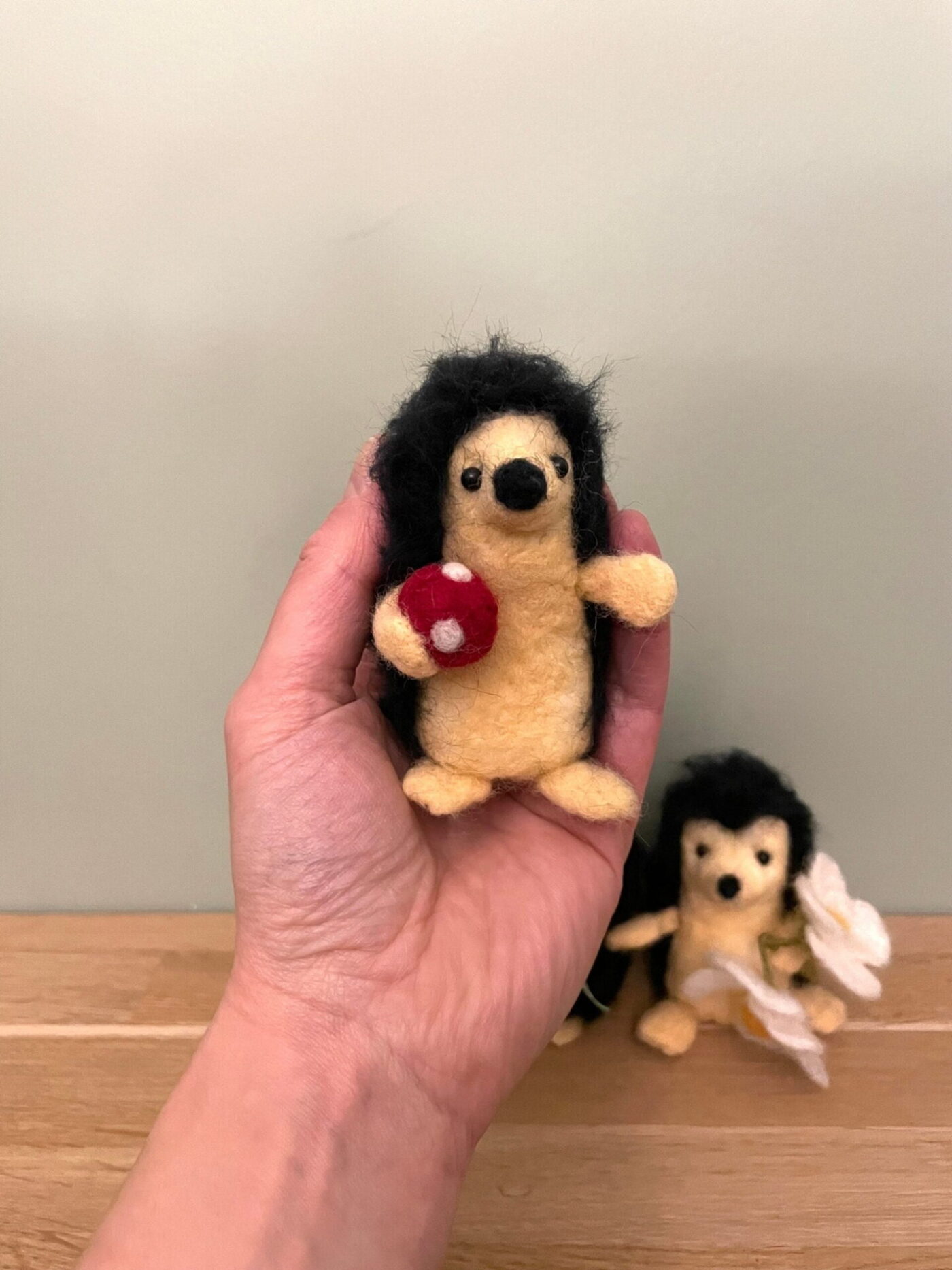 Wool Felted Hedgehog Family — side view