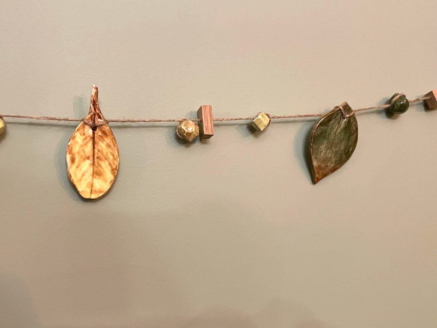 Ceramic Autumn Leaf Garland — Green, Yellow & Brown — scale view