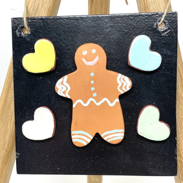 Handmade Ceramic pottery Gingerbread man fridge magnet with hearts and a metallic board in a set