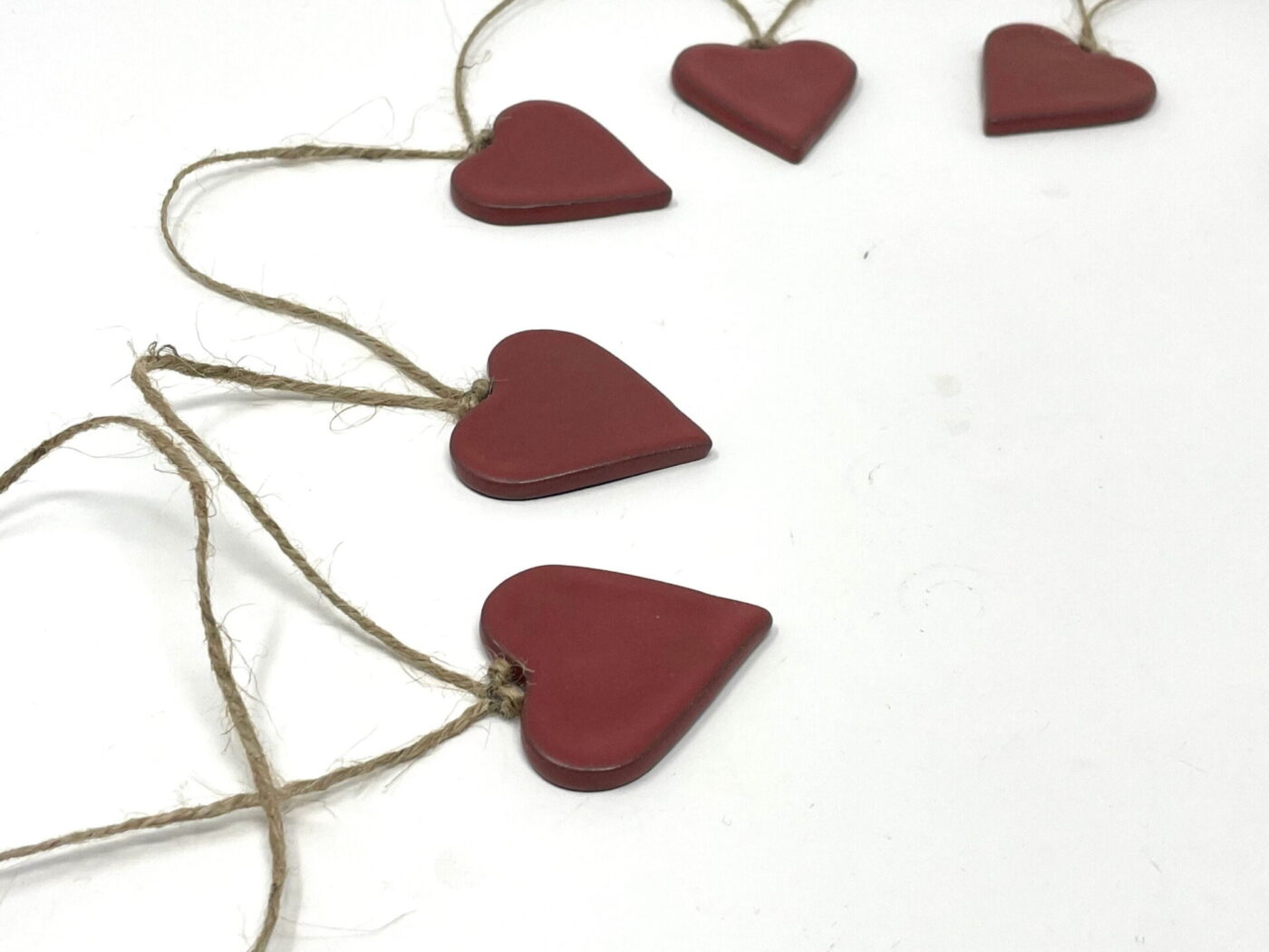 Satin Red Ceramic Heart Garland (9 Hearts) — styling detail