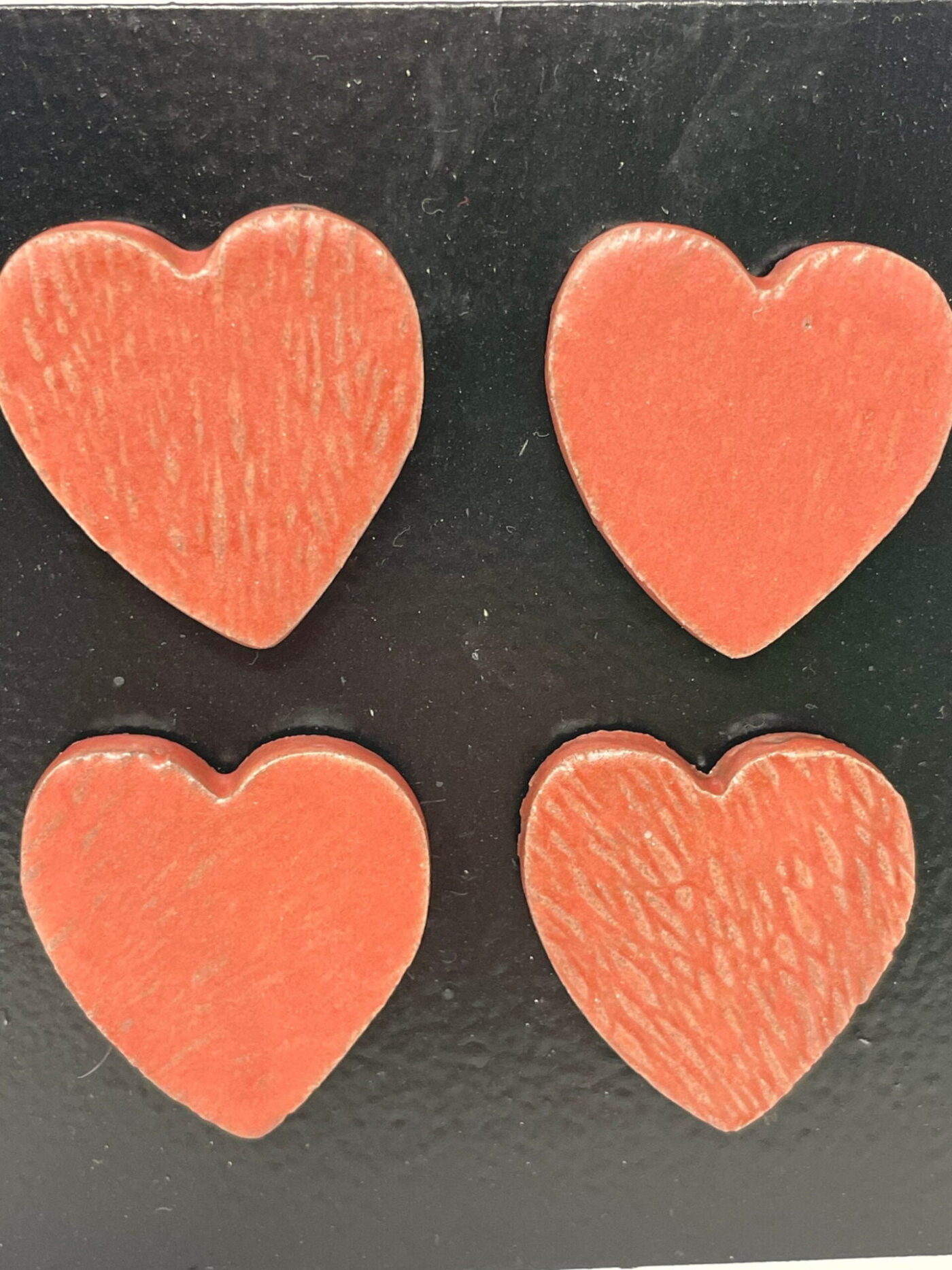 Satin Matte Red Heart Magnets — Set of 4 — in use