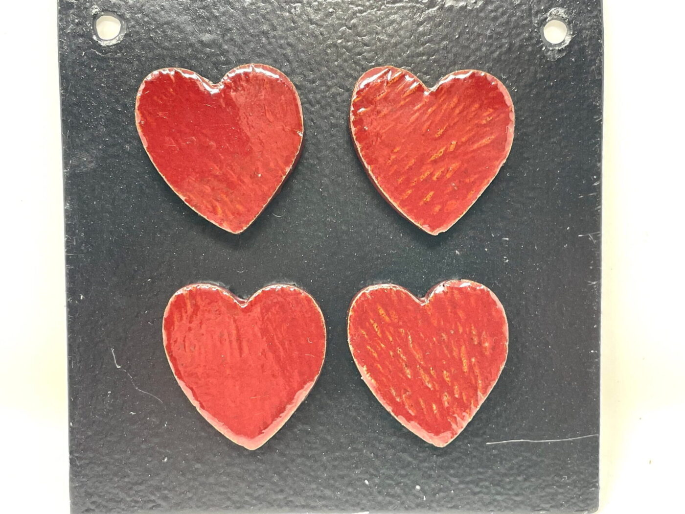 Firebrick Red Heart Magnets — Set of 4 — in use