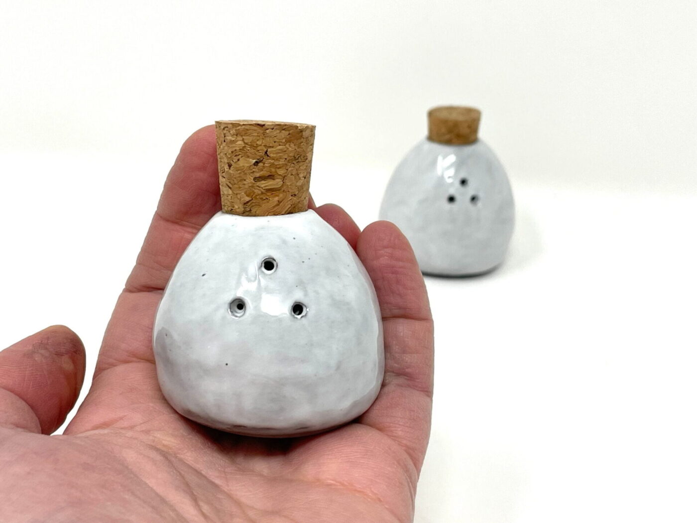White & Grey Pinch-Pot Salt & Pepper Shakers — close-up
