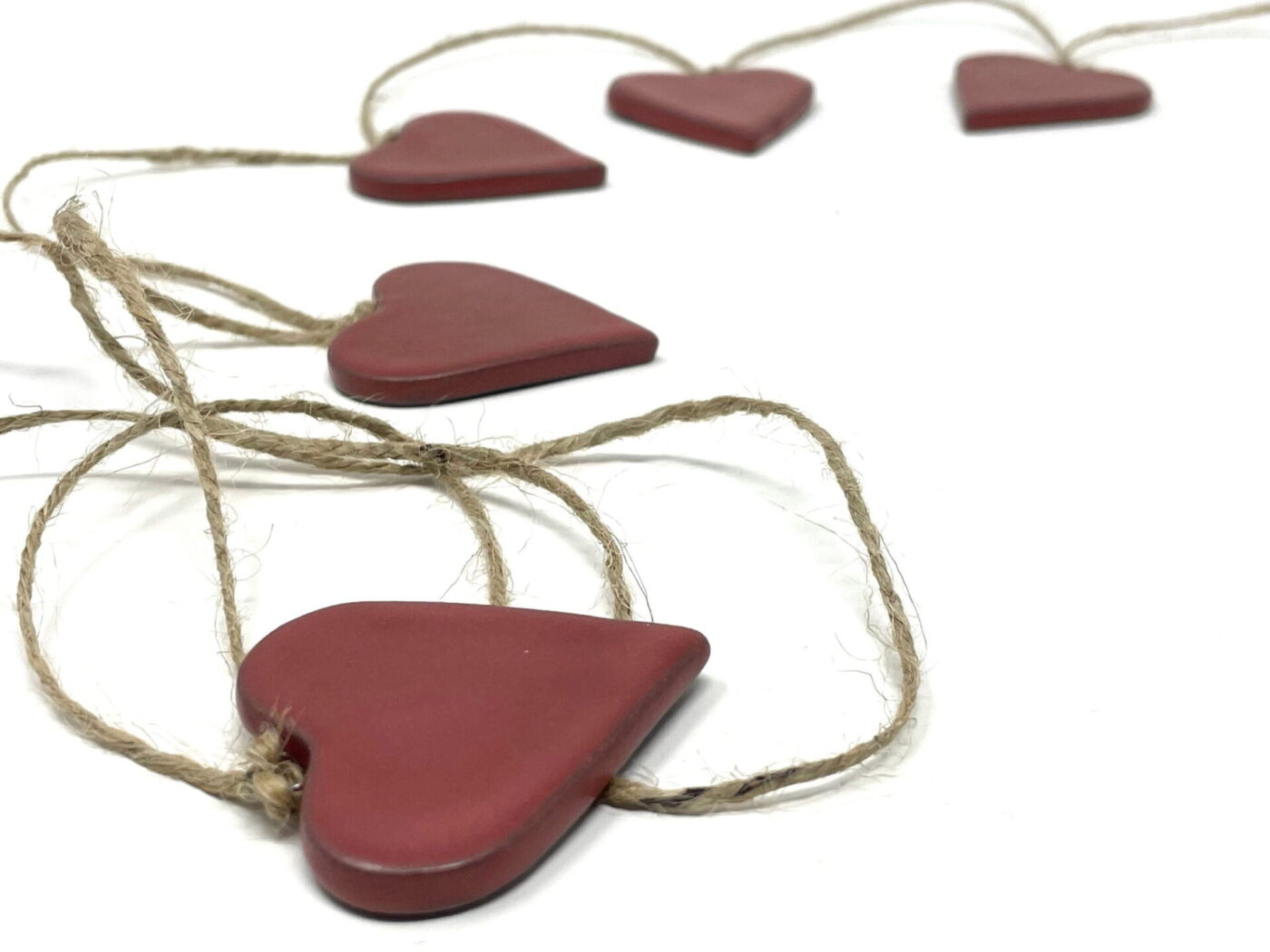 Satin Red Ceramic Heart Garland (9 Hearts) — in use