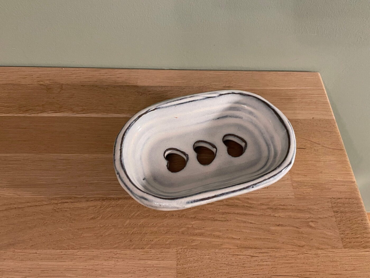 White Ceramic Soap Dish — Heart-Shaped Drainage Holes — in use