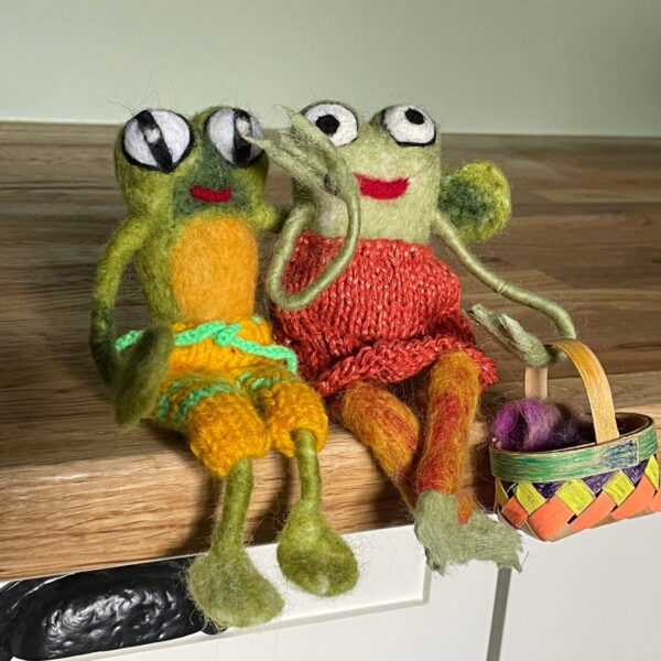 Handmade wool needle felted Mr Frog and Mrs Frog with long arms and legs in a knitted summer dress