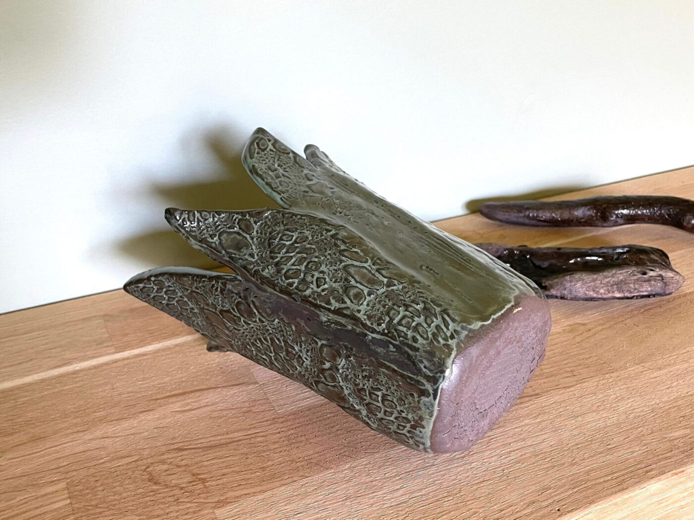 Dark Green Leaf-Textured Ceramic Vase — in use