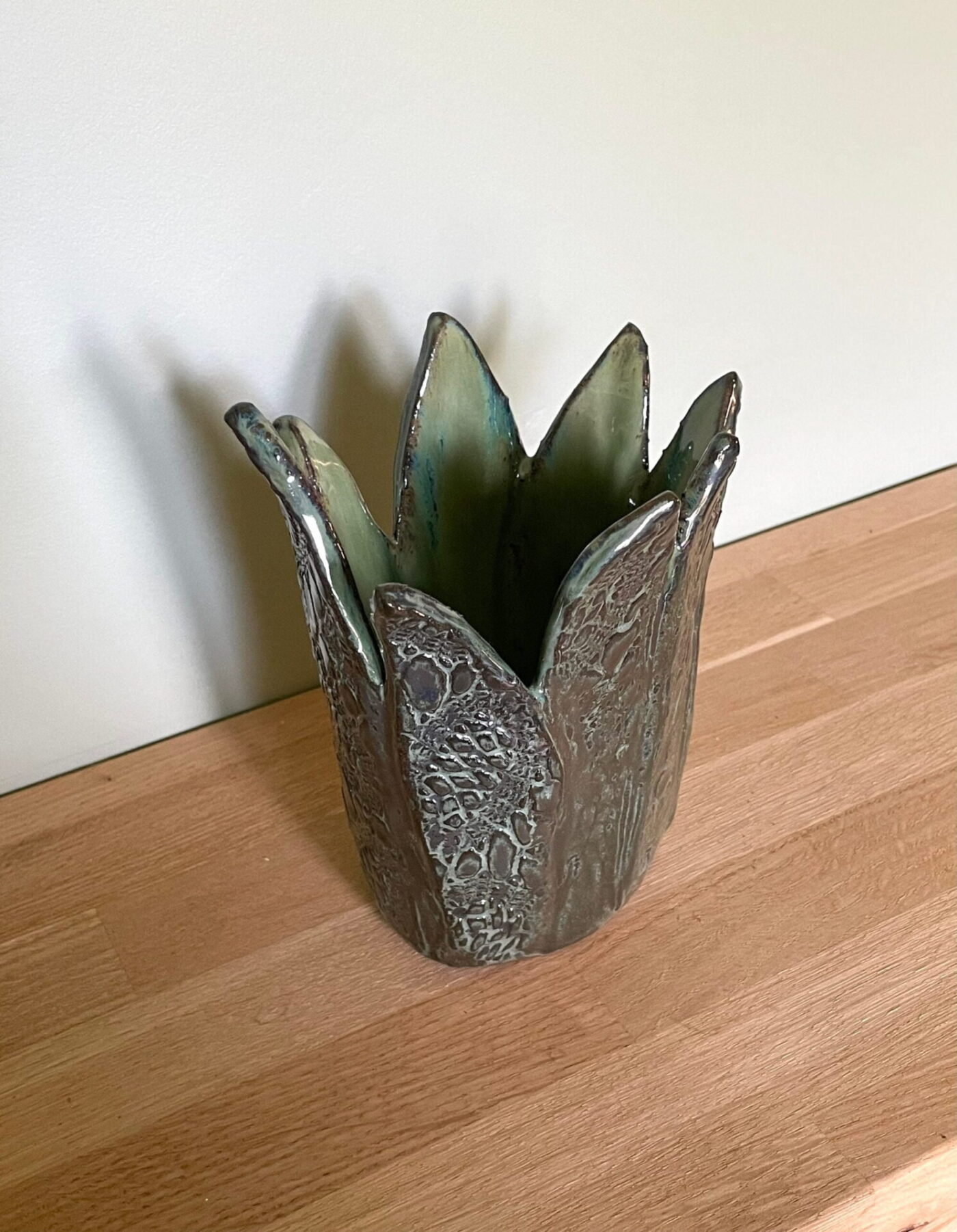 Dark Green Leaf-Textured Ceramic Vase — top view