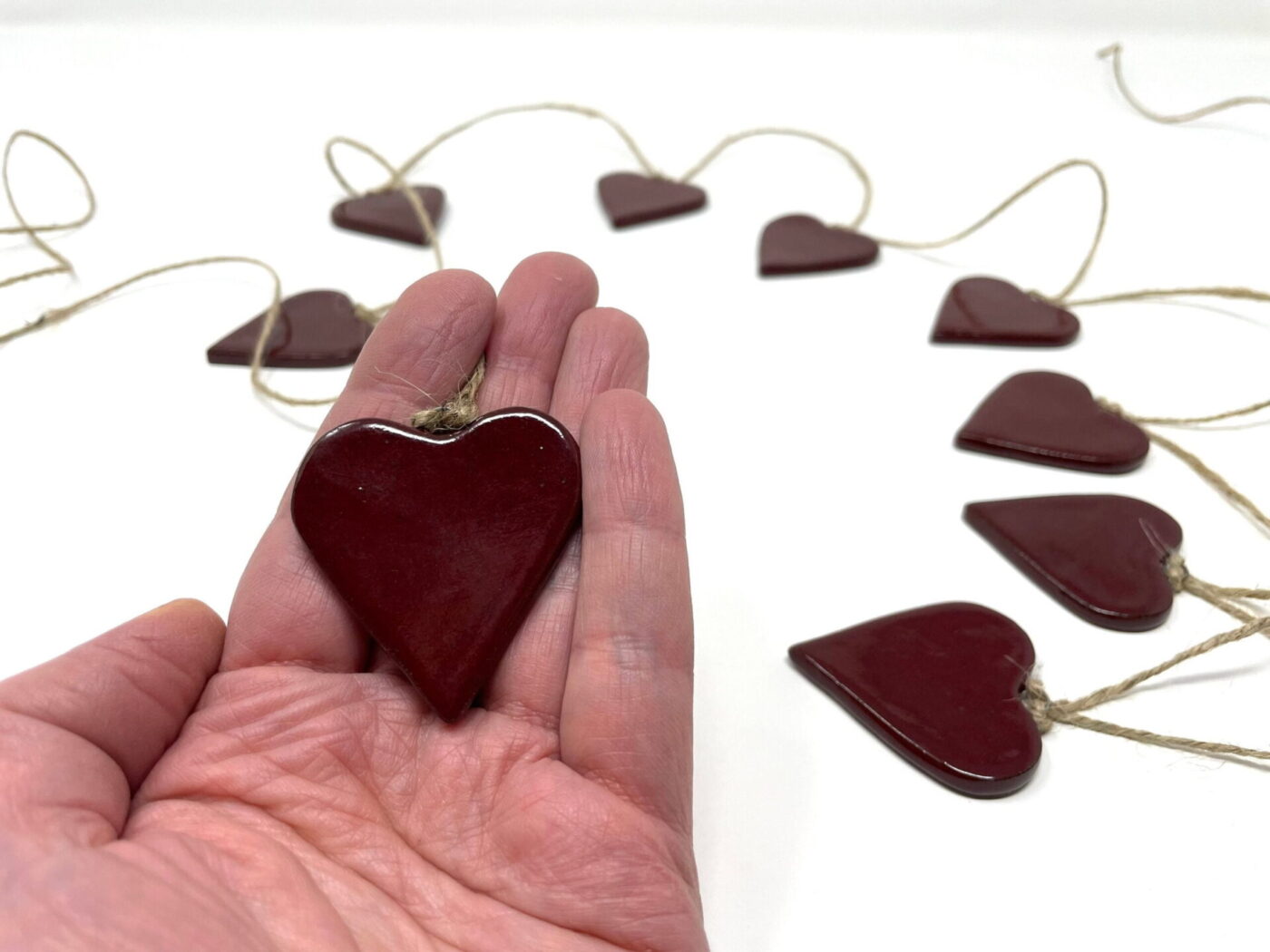 Deep Firebrick Red Ceramic Heart Garland (9 Hearts) — detail view