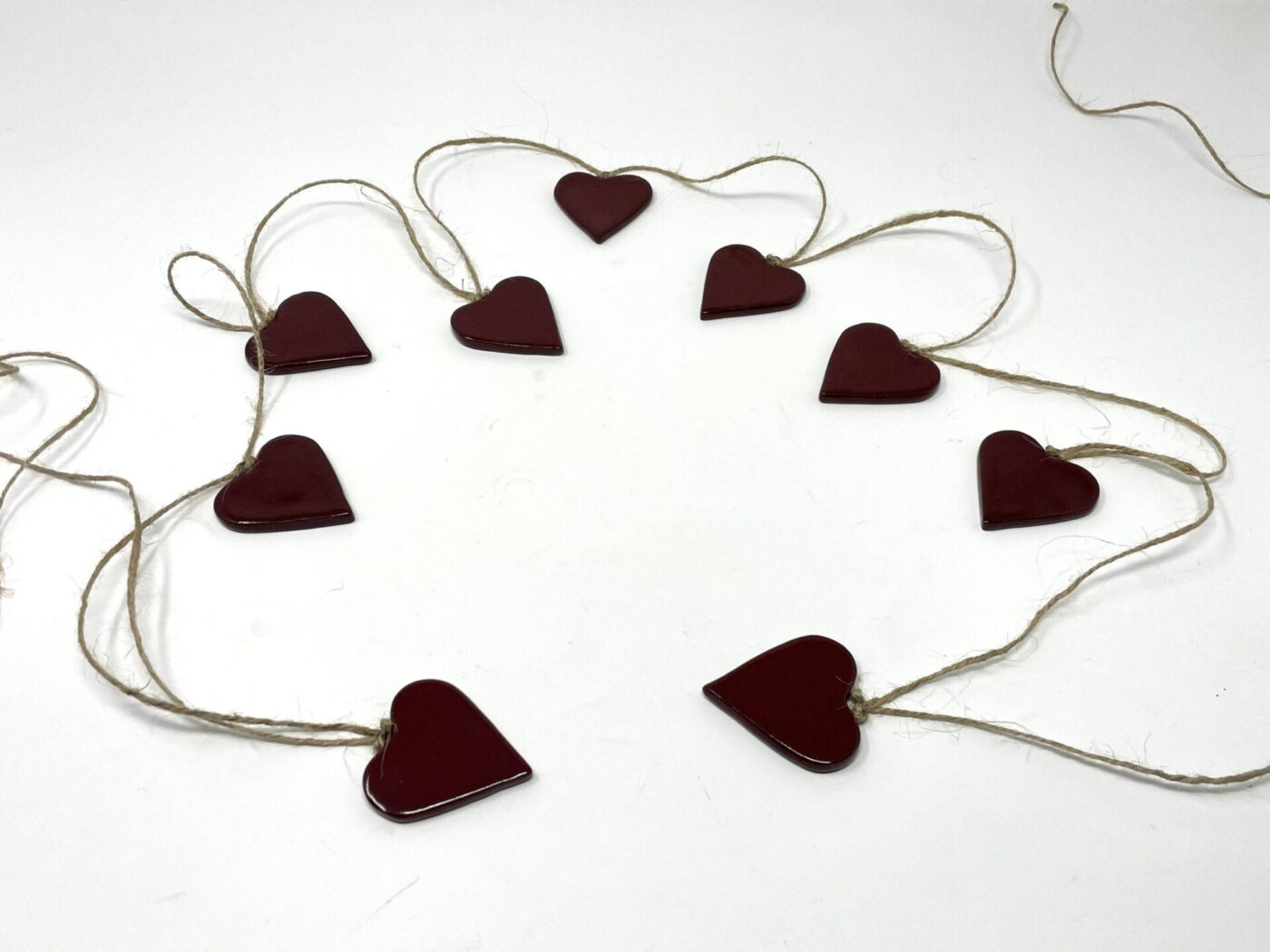 Deep Firebrick Red Ceramic Heart Garland (9 Hearts) — styling detail