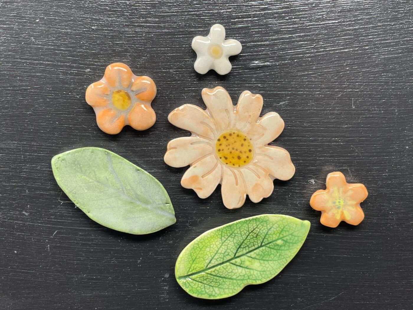 Orange Leaf & Flower Ceramic Magnet Set — in use