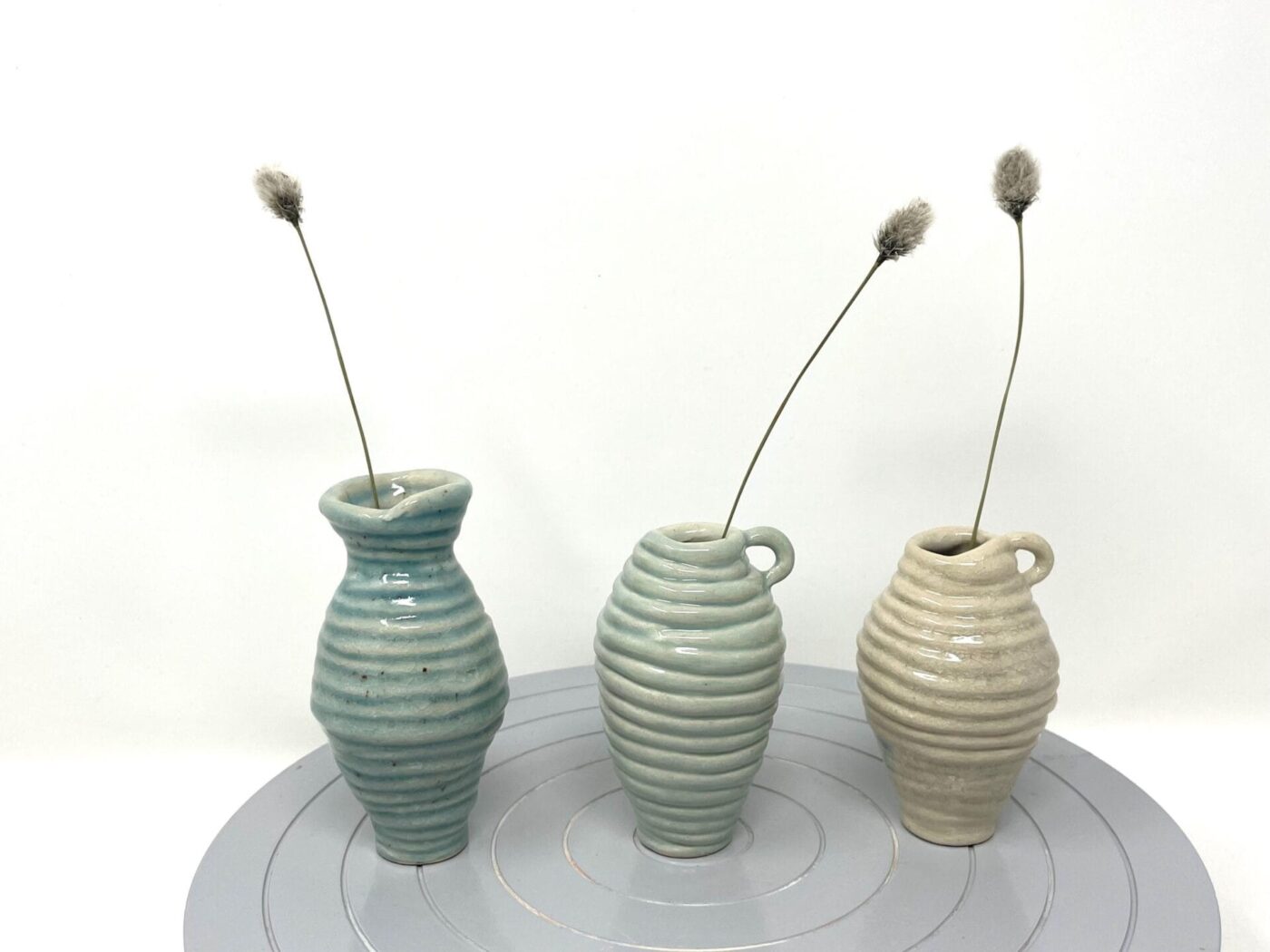 Coiled Mini Vase Trio (Bone, Blue, Teal) — close-up