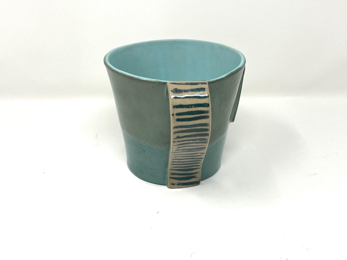 XL Ceramic Mug — "M" Initial, Green & Light Blue — in use