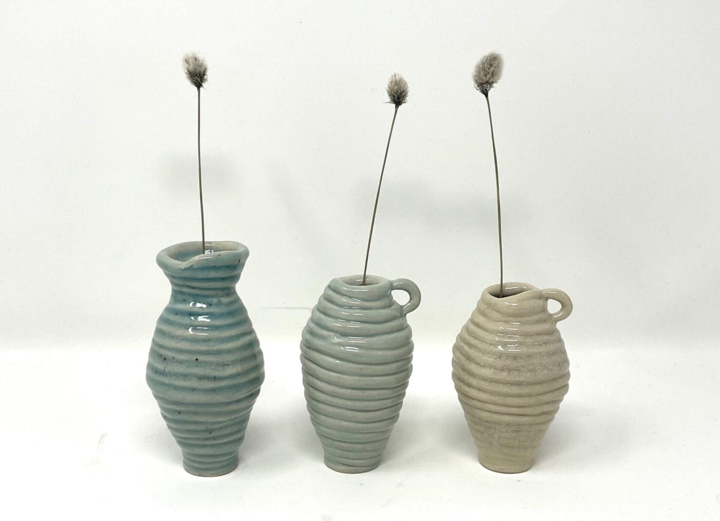 Coiled Mini Vase Trio (Bone, Blue, Teal) — styling detail