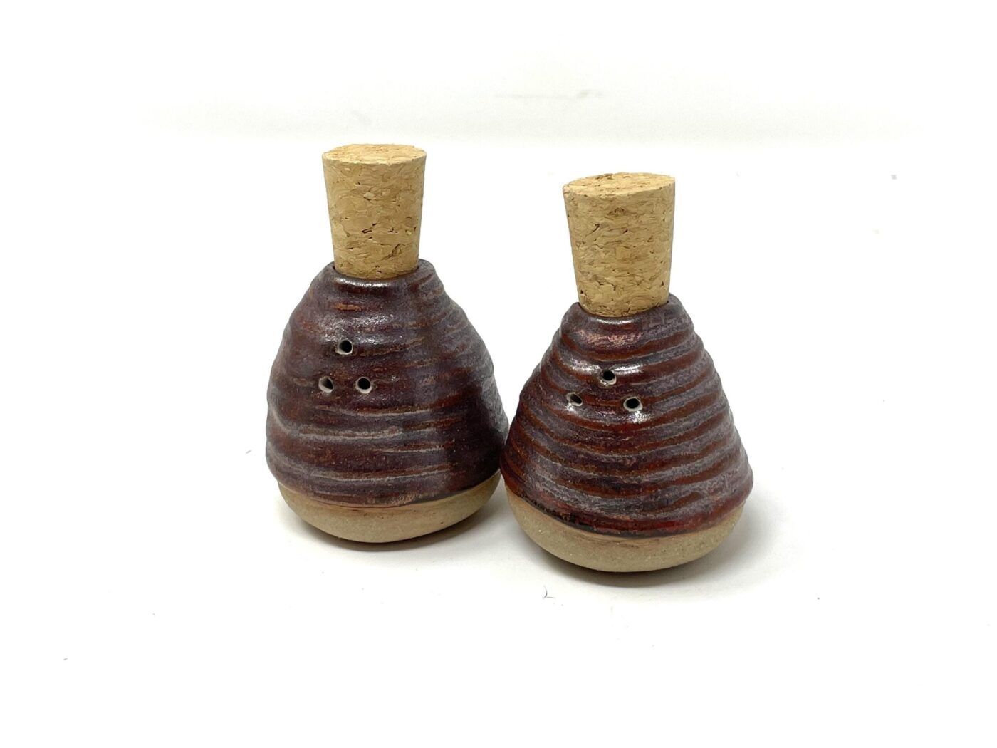 Copper-Glazed Coiled Ceramic Salt Shaker — in use
