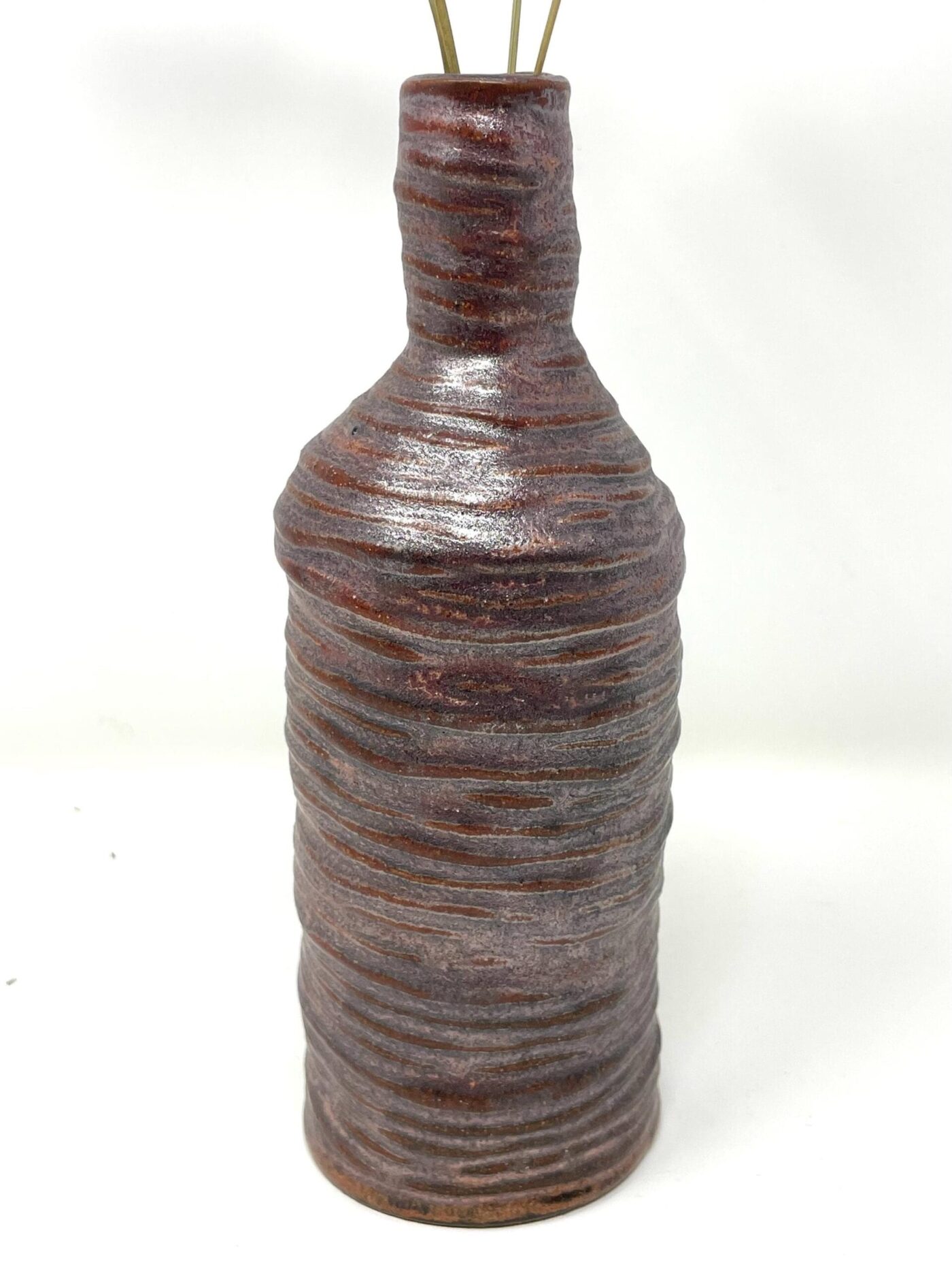 Coiled Copper Metallic Bottle Bud Vase — in use