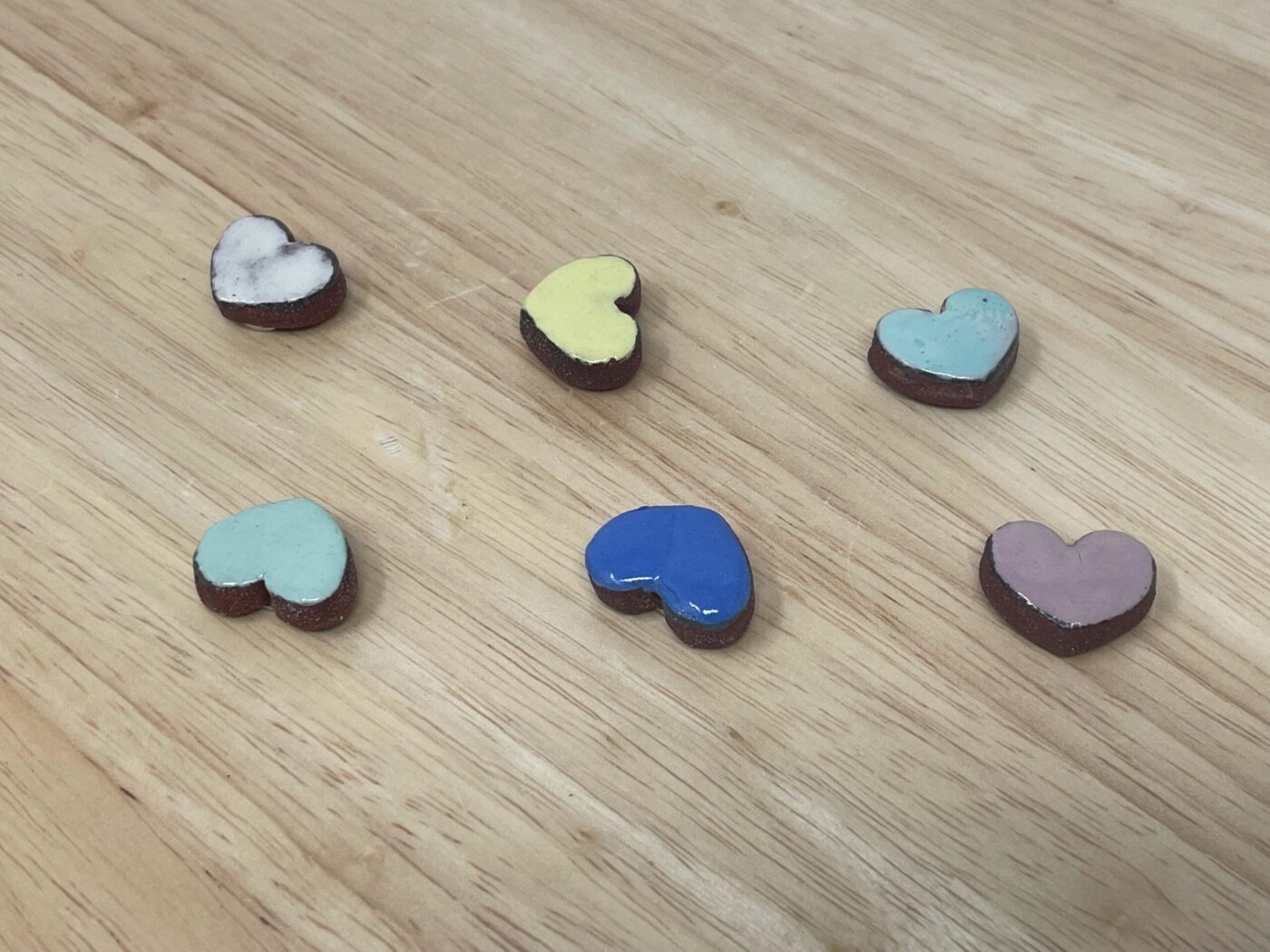 Pastel Ceramic Heart Magnets — Set of 6 (Terracotta) — in use