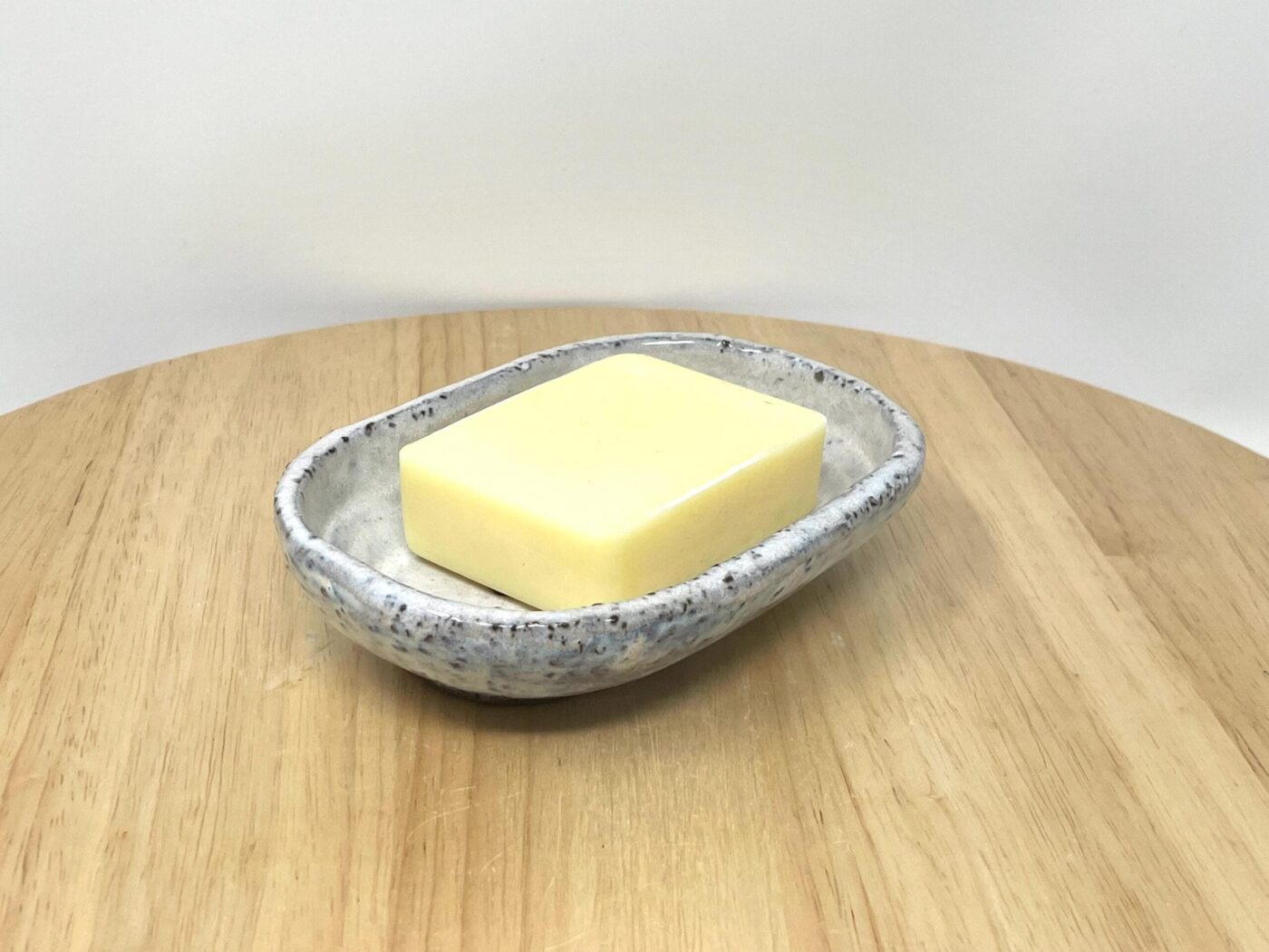 Off-White Heart Soap Dish, Grey Clay & Black Stone — in use
