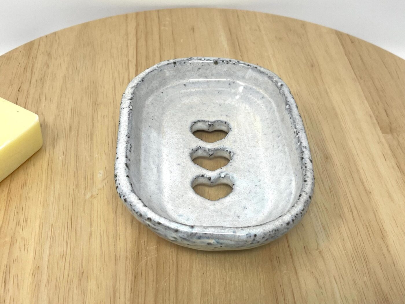 Off-White Heart Soap Dish, Grey Clay & Black Stone — styling detail