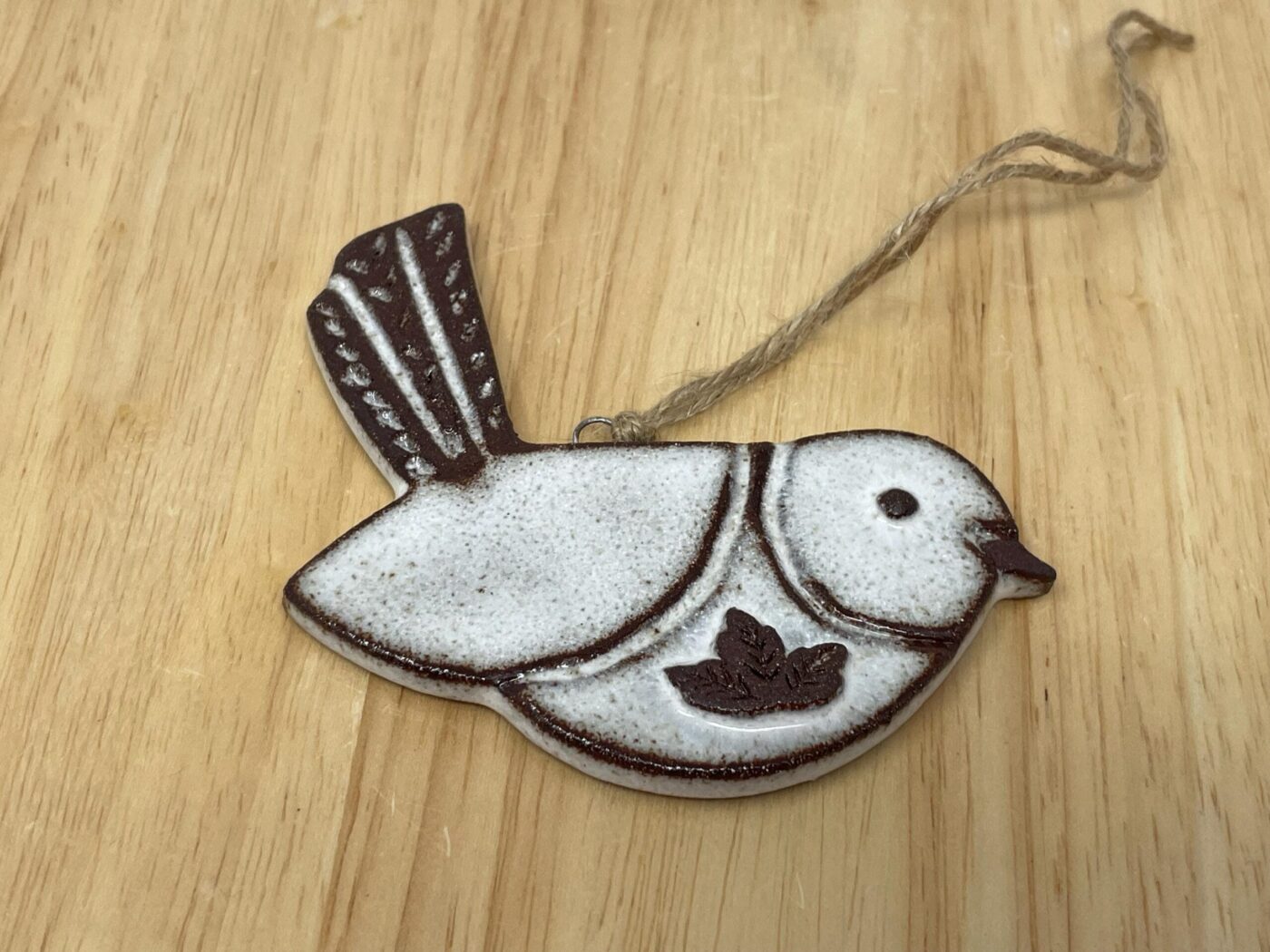 Hanging Ceramic Bird — Terracotta & White Glaze (Leaves) — in use