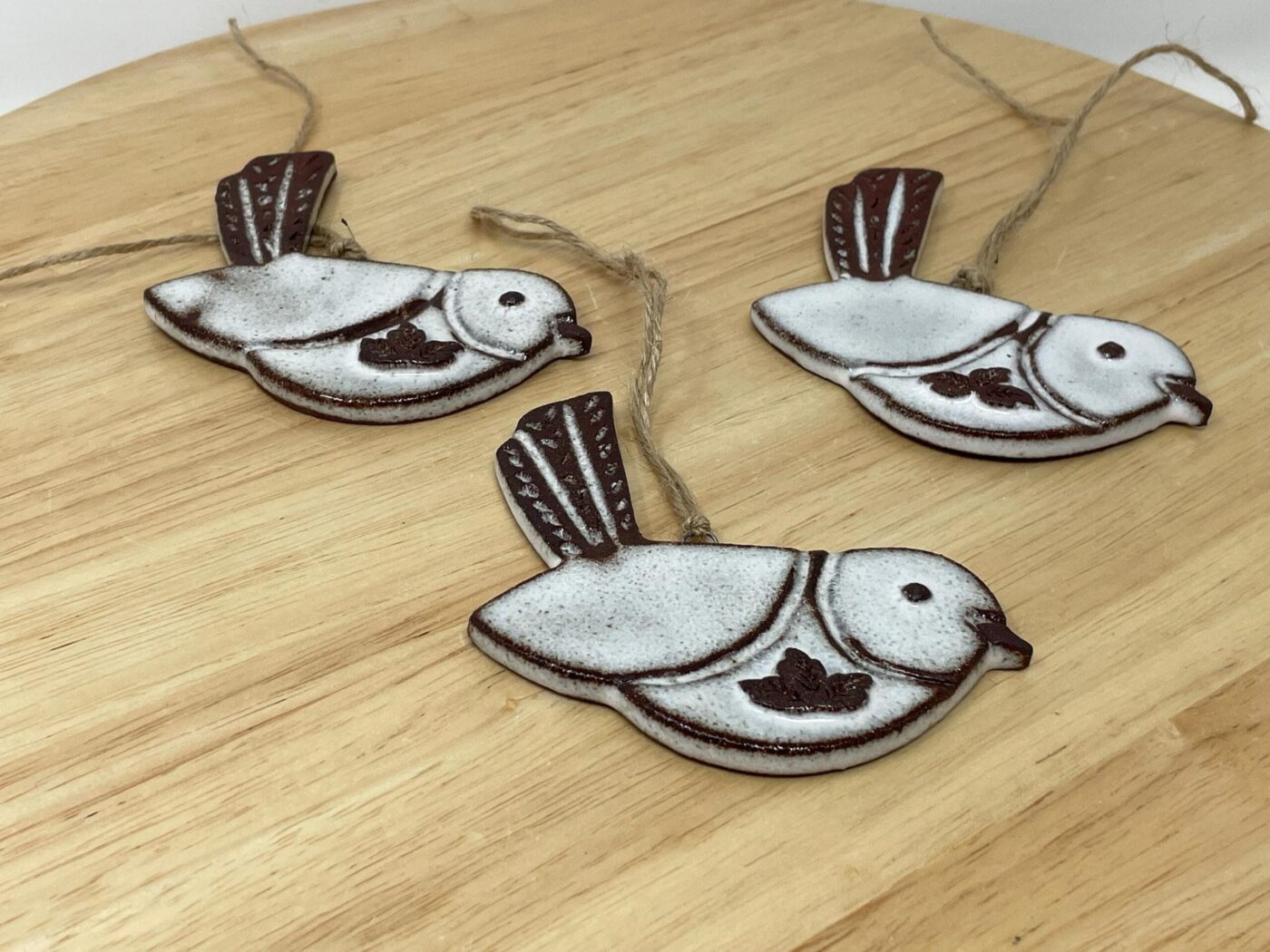Hanging Ceramic Bird — Terracotta & White Glaze (Leaves) — scale view