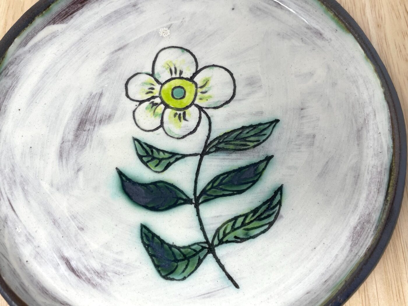 Sgraffito Flower Terracotta Plate — Green & Blue — in use