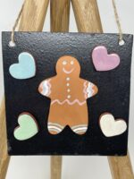 Handmade Ceramic pottery Gingerbread man fridge magnet with hearts and a metallic board in a set