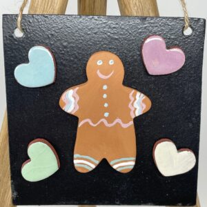 Handmade Ceramic pottery Gingerbread man fridge magnet with hearts and a metallic board in a set