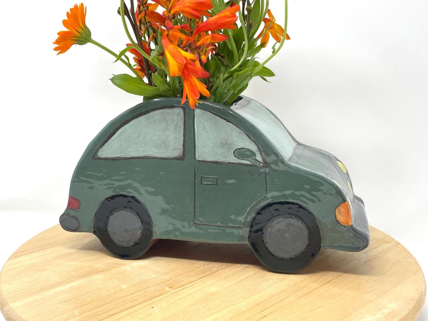 Dark Teal Ceramic Car Vase with Floral Roof — detail view