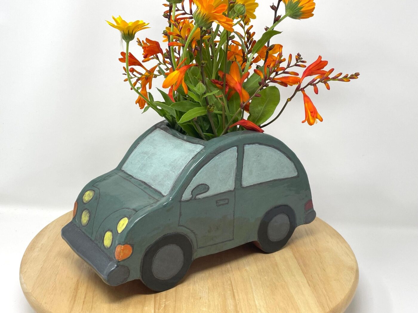 Dark Teal Ceramic Car Vase with Floral Roof — back view