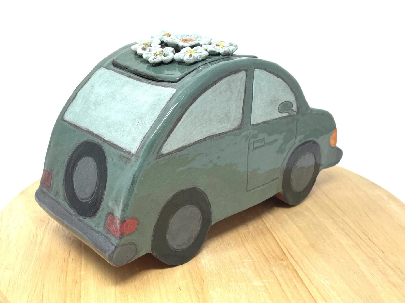 Dark Teal Ceramic Car Vase with Floral Roof — scale view