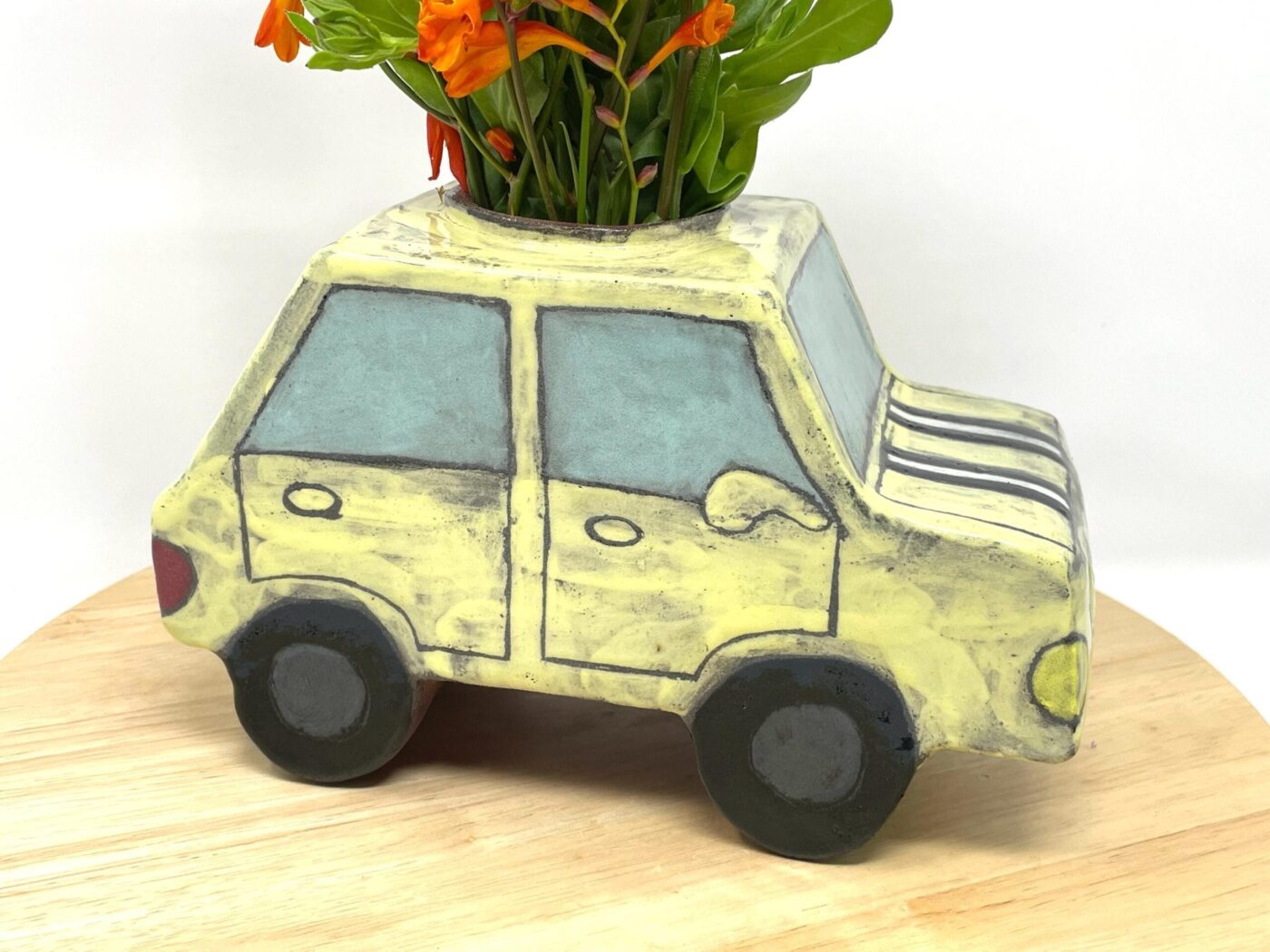 Pale Yellow Ceramic Car Vase with Floral Roof — back view