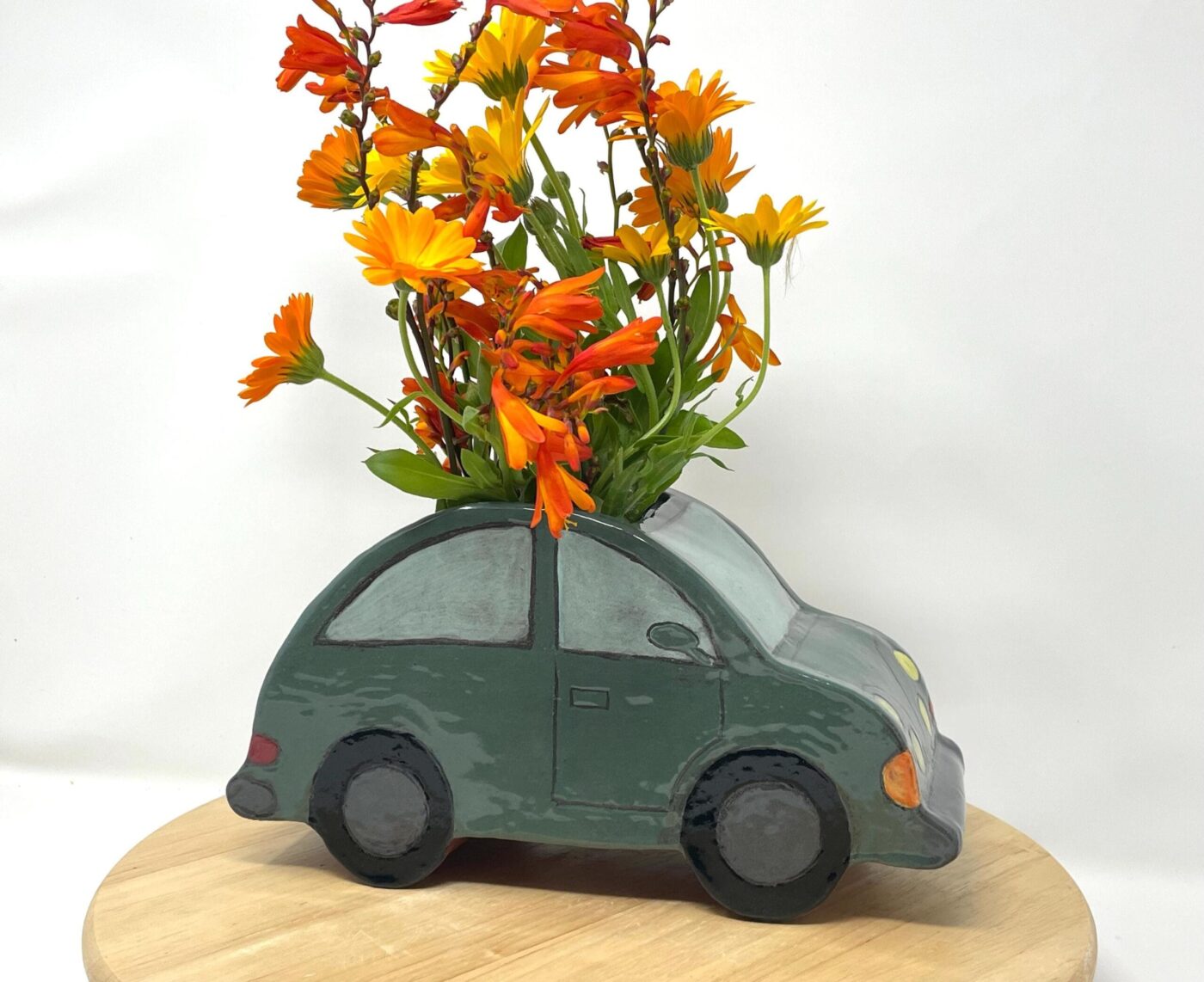 il_fullxfull.7165389769_h70j.jpg Dark Teal Ceramic Car Vase with Floral Roof
