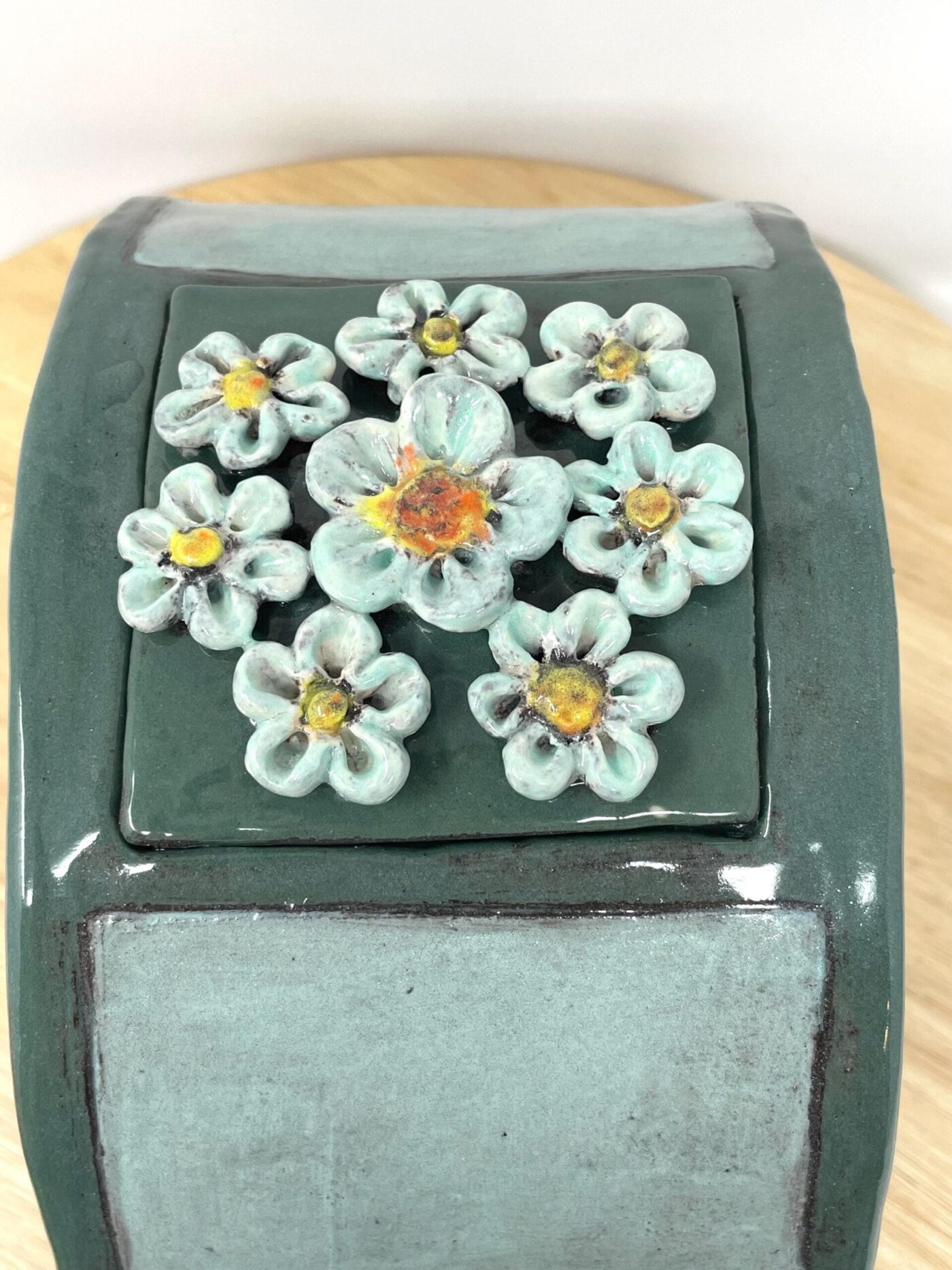Dark Teal Ceramic Car Vase with Floral Roof — styling detail