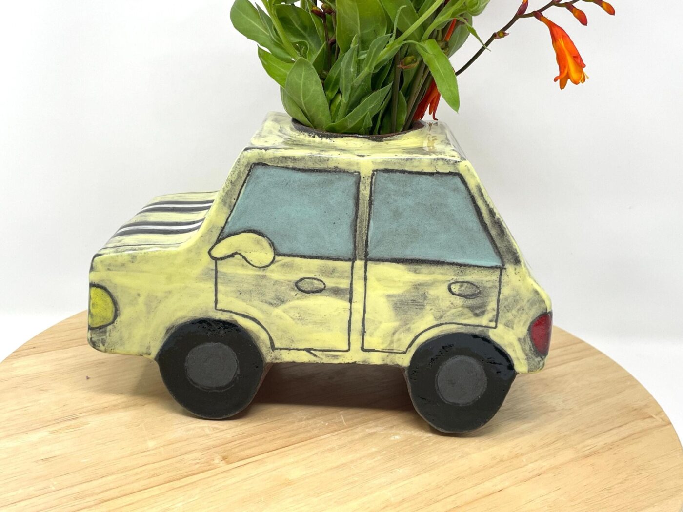Pale Yellow Ceramic Car Vase with Floral Roof — detail view