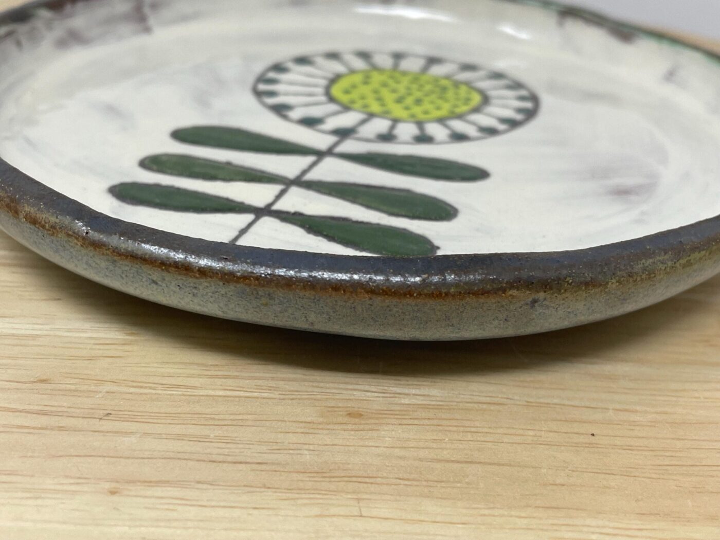 Artisan folk art sunflower plate — hand-scratched botanical design — Fabode Ceramics