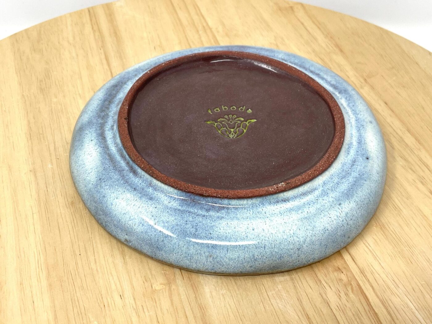 Handmade sunflower ceramic plate from above — terracotta clay — Fabode Ceramics