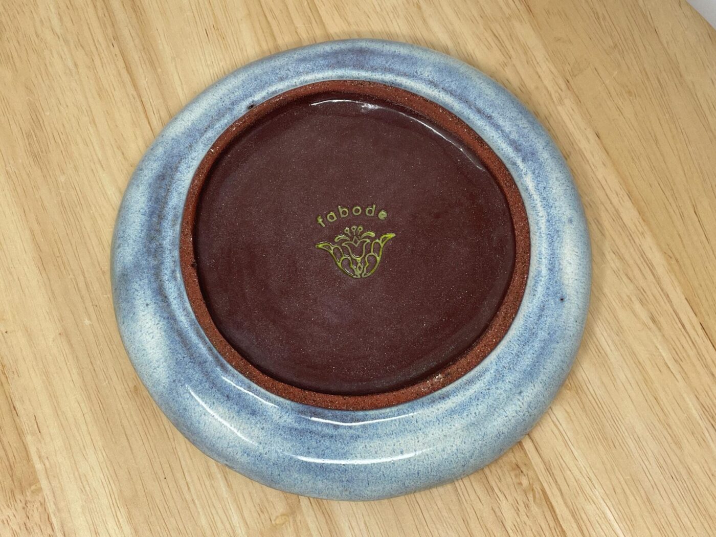 Folk art sunflower plate — lime-green dotted centre with radiating lines — Fabode Ceramics