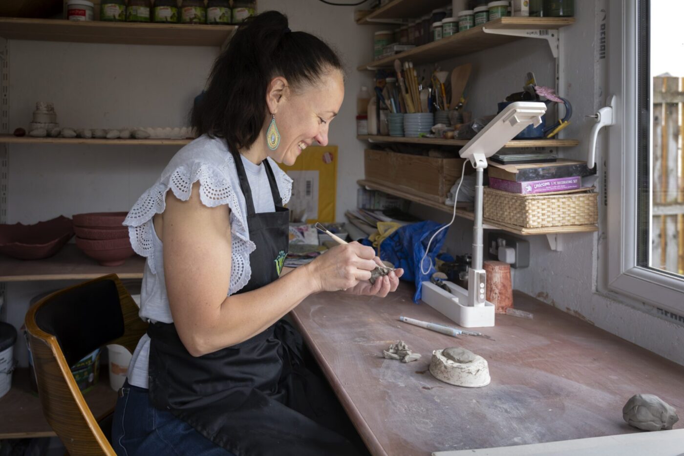 Marta's hands working clay in the Fabode studio in Edinburgh