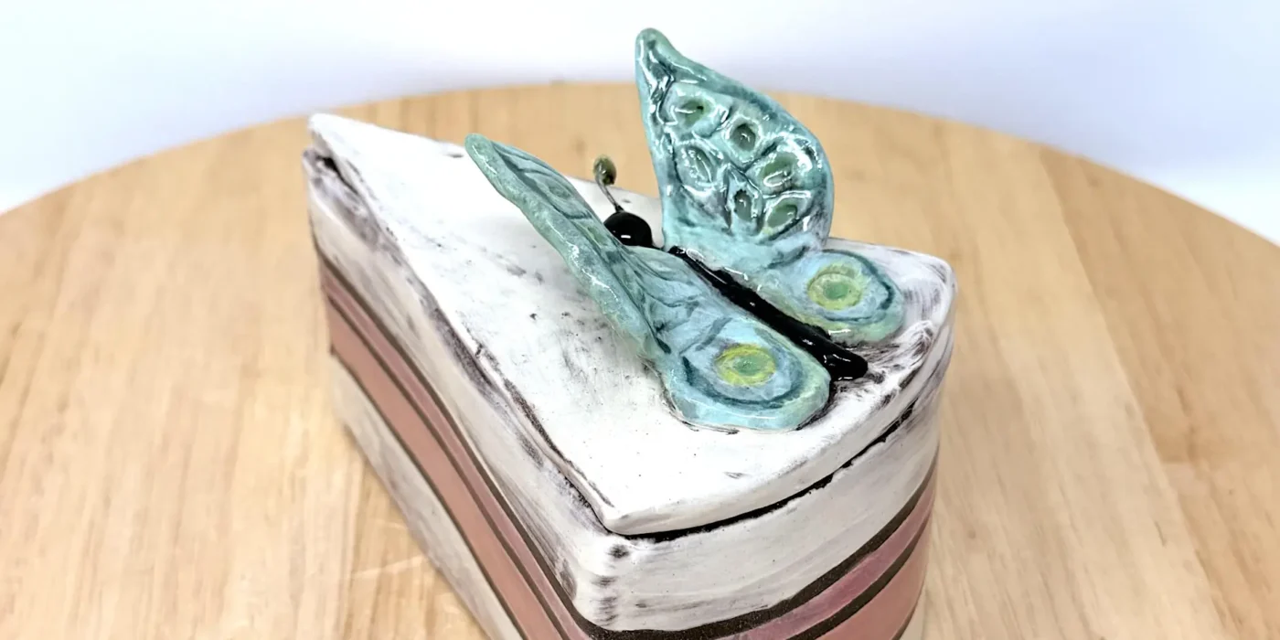 Hand-built ceramic cake slice with butterfly lid, made in Marta's Edinburgh studio