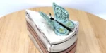 Hand-built ceramic cake slice with butterfly lid, made in Marta's Edinburgh studio