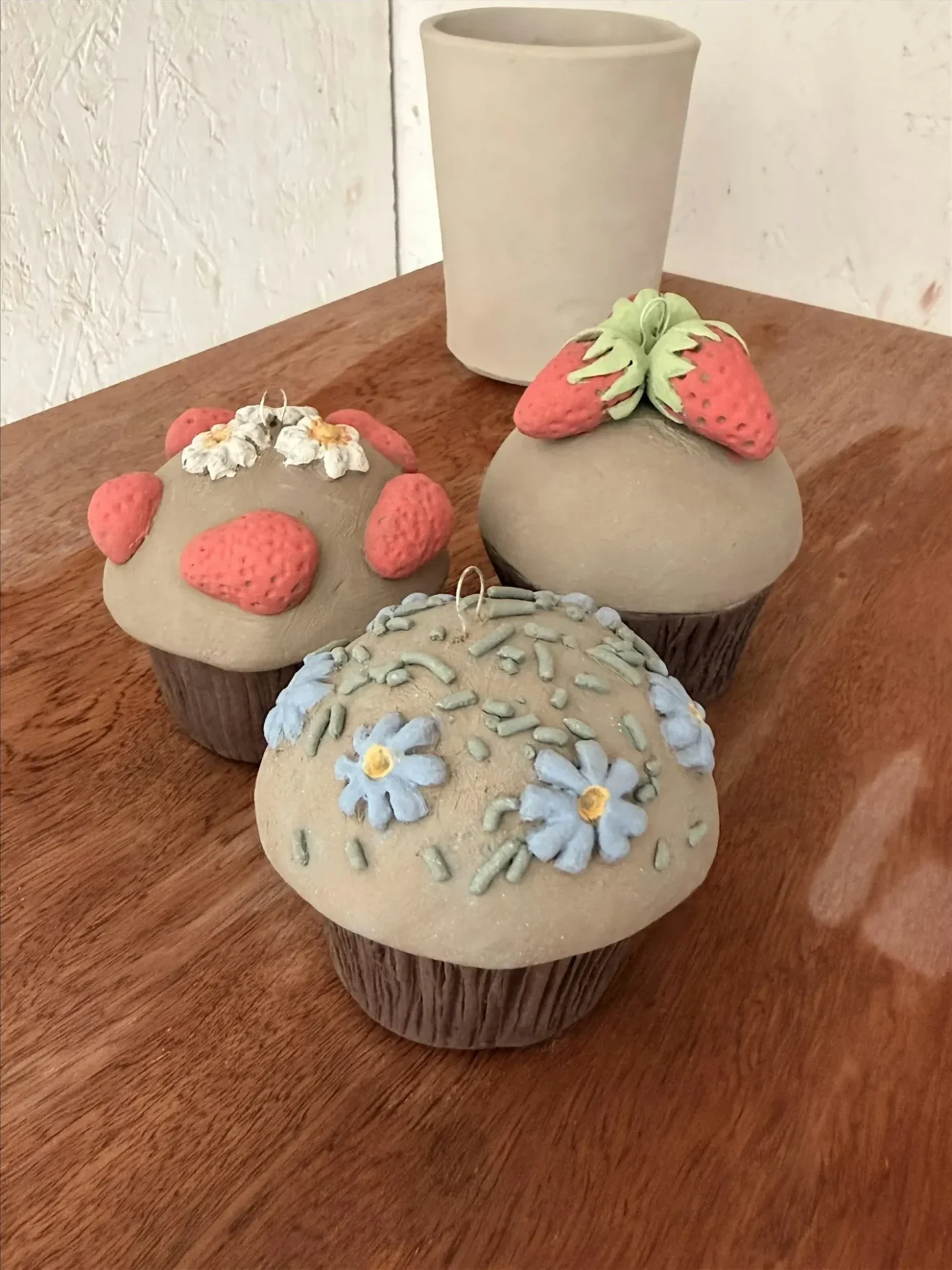 Three hand-built ceramic muffin treasure boxes from Marta's workshop