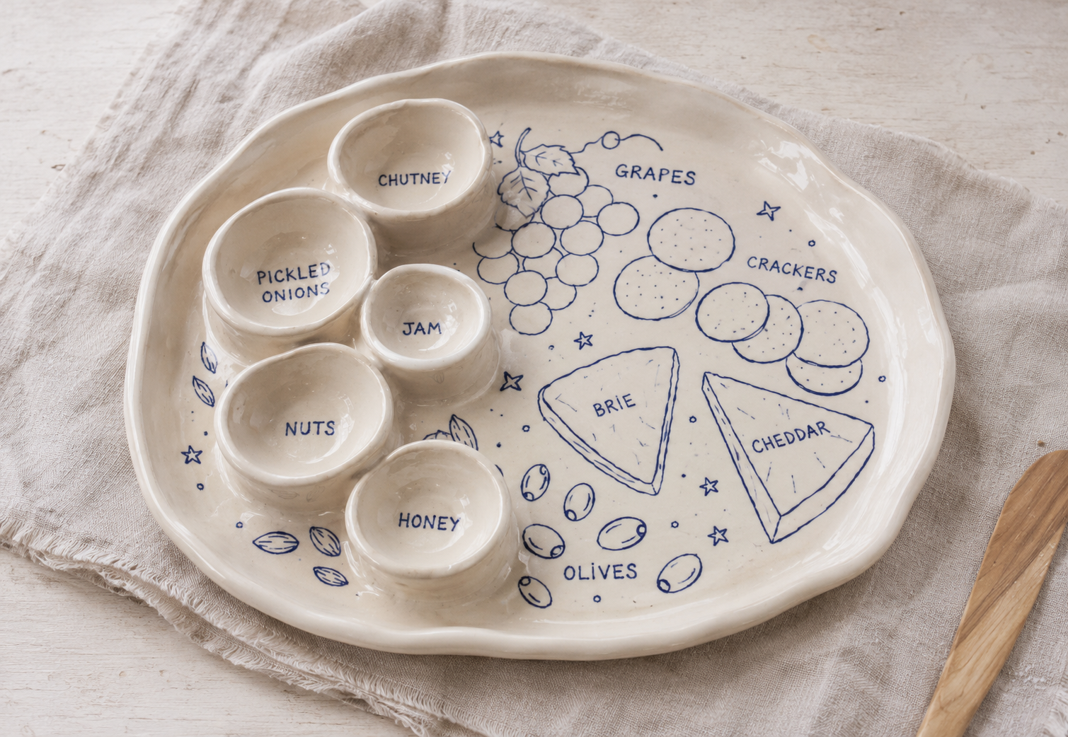 Ceramic platter with attached small bowls for dips and snacks