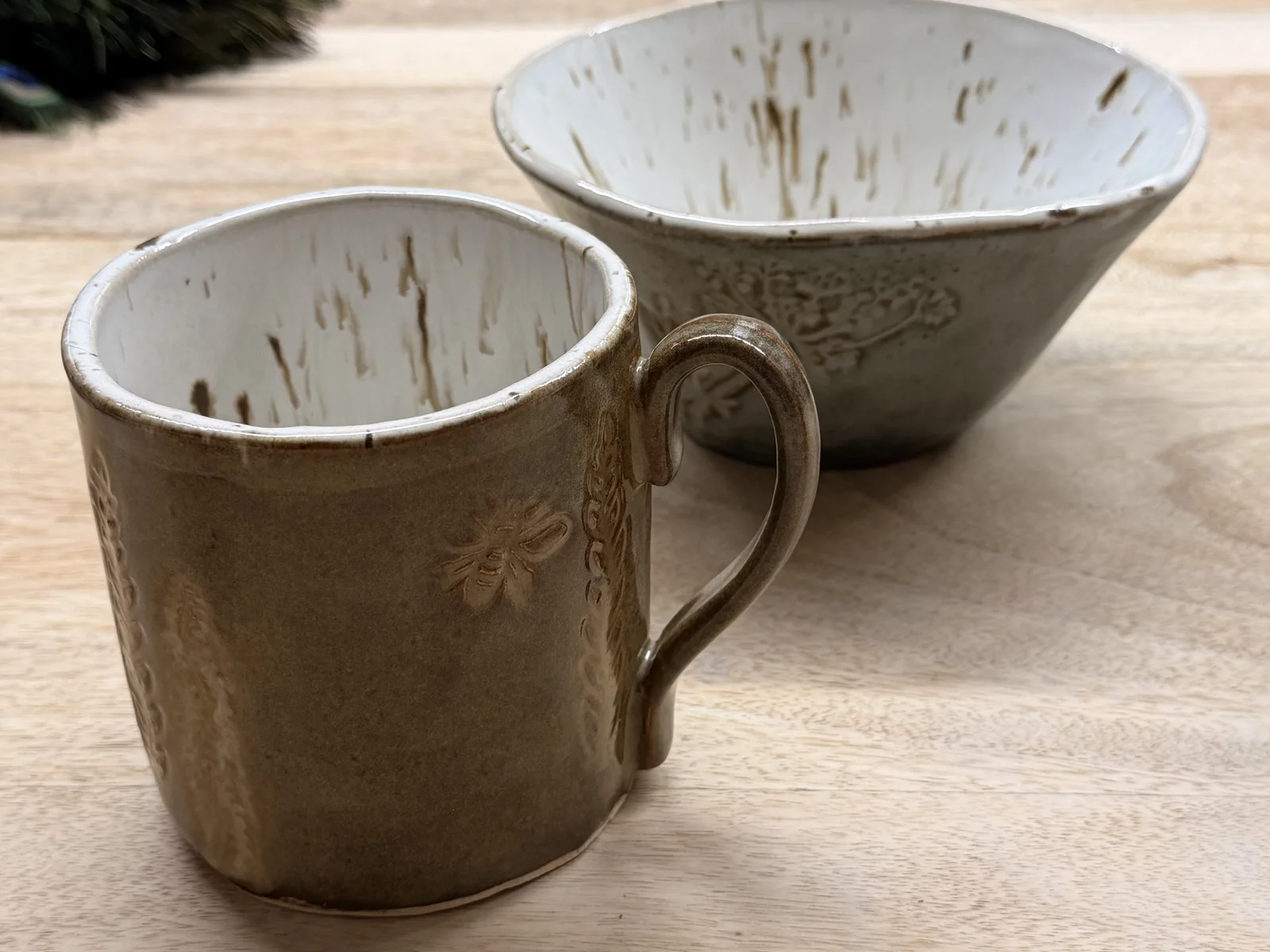 Handmade mug and bowl with warm neutral glazes made at Fabode